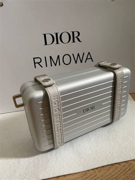 dior clutch rimowa|Dior clutch with hand strap.